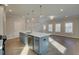 Open-concept kitchen featuring an island with a sink and stainless steel appliances at 4511 Twinberry Dr, Powder Springs, GA 30127