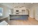 Kitchen with island, stainless appliances, and hardwood floors at 4511 Twinberry Dr, Powder Springs, GA 30127