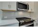 Beautiful kitchen featuring stainless steel appliances and geometric backsplash at 4511 Twinberry Dr, Powder Springs, GA 30127