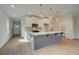 Kitchen with a gray island, white cabinets, and stainless steel appliances at 4511 Twinberry Dr, Powder Springs, GA 30127