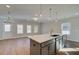 Spacious living room with ample natural light and a gray kitchen island at 4511 Twinberry Dr, Powder Springs, GA 30127