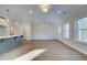 Open living space featuring luxury vinyl plank flooring and modern lighting at 4511 Twinberry Dr, Powder Springs, GA 30127