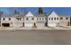 Street view of new townhomes showcasing varied architectural styles and attached garages at 4511 Twinberry Dr, Powder Springs, GA 30127