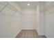 Walk-in closet with wire shelving and carpeted floor; plenty of storage at 4511 Twinberry Dr, Powder Springs, GA 30127
