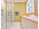 Updated bathroom with a glass enclosed shower, double vanity, and neutral tile at 50 Rumson Ne Way, Atlanta, GA 30305
