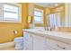 Bathroom with a white marble-top vanity, large mirror, and tiled shower with curtain at 50 Rumson Ne Way, Atlanta, GA 30305