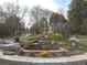 Neighborhood park featuring a water feature, sculptures, flowers, and landscaping at 50 Rumson Ne Way, Atlanta, GA 30305