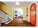 Foyer with hardwood floors, arched doorway, fireplace, and staircase leading to the upper level at 50 Rumson Ne Way, Atlanta, GA 30305