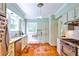 Bright kitchen with stainless appliances, terracotta tile floors, and built-in cabinets with ample storage at 50 Rumson Ne Way, Atlanta, GA 30305
