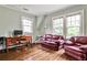 Bright living room with two couches, desk, and hardwood floors at 50 Rumson Ne Way, Atlanta, GA 30305