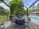 Inviting poolside seating area with shaded pergola, ideal for relaxing and socializing near the swimming pool at 50 Rumson Ne Way, Atlanta, GA 30305