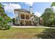 Home has a large backyard, covered deck and stone staircase to the yard at 2922 Heart Pine Way, Buford, GA 30519