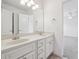 Bathroom offers a double vanity with white cabinets and modern fixtures at 2922 Heart Pine Way, Buford, GA 30519