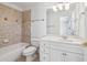 Bathroom with tiled shower/tub combination and updated vanity with drawers at 2922 Heart Pine Way, Buford, GA 30519