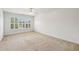 This bedroom has natural light with large window and neutral carpet at 2922 Heart Pine Way, Buford, GA 30519