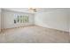 This bedroom has natural light with large window and neutral carpet at 2922 Heart Pine Way, Buford, GA 30519