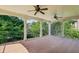 This deck is covered and spacious with two ceiling fans and columns at 2922 Heart Pine Way, Buford, GA 30519