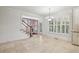 Sunlit dining area features large windows with classic plantation shutters at 2922 Heart Pine Way, Buford, GA 30519