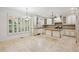 Open-concept kitchen with an island, granite countertops, and bright natural light at 2922 Heart Pine Way, Buford, GA 30519