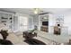 Comfortable upstairs living area with built-in desks, a TV, and double french doors at 2922 Heart Pine Way, Buford, GA 30519