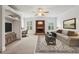 Spacious bonus room featuring hardwood floors, a brick fireplace, a TV, and built in shelving at 2922 Heart Pine Way, Buford, GA 30519