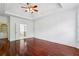 Spacious main bedroom boasts a tray ceiling and hardwood floors at 2922 Heart Pine Way, Buford, GA 30519