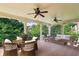 Inviting outdoor porch with ample seating and ceiling fans, perfect for relaxing and entertaining at 2922 Heart Pine Way, Buford, GA 30519