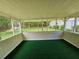Enclosed back porch featuring a screen and a view of the backyard at 417 Ohern Ct, Stone Mountain, GA 30088