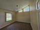 Angled bedroom with high ceilings and light fixture at 417 Ohern Ct, Stone Mountain, GA 30088