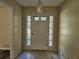 Inviting foyer with a stylish front door and decorative lighting, providing a warm welcome at 417 Ohern Ct, Stone Mountain, GA 30088
