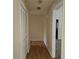 Bright hallway with closet and neutral paint, providing access to various rooms in the home at 417 Ohern Ct, Stone Mountain, GA 30088
