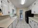 Kitchen with white cabinets and modern appliances at 417 Ohern Ct, Stone Mountain, GA 30088