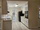 Bright kitchen features sleek appliances, white cabinets, and tiled flooring at 417 Ohern Ct, Stone Mountain, GA 30088