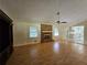Inviting living room with brick fireplace, hardwood floors, and view to the kitchen at 417 Ohern Ct, Stone Mountain, GA 30088