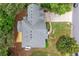 Aerial view of the house, featuring a well-maintained roof, a spacious backyard deck, and a neatly manicured lawn at 4294 Silver Peak Pkwy, Suwanee, GA 30024