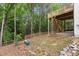 Picturesque backyard featuring mature trees, wooden fencing and elevated patio deck at 4294 Silver Peak Pkwy, Suwanee, GA 30024
