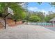 Basketball court with a hoop next to the community pool and other amenities providing outdoor activities and recreation at 4294 Silver Peak Pkwy, Suwanee, GA 30024