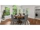 Charming breakfast nook with beautiful windows and comfortable seating at 4294 Silver Peak Pkwy, Suwanee, GA 30024