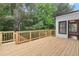 Private wood deck provides an outdoor space to relax and enjoy the natural surroundings at 4294 Silver Peak Pkwy, Suwanee, GA 30024