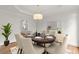 Elegant dining room with chandelier, table set for entertaining at 4294 Silver Peak Pkwy, Suwanee, GA 30024