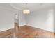 Open dining room with hardwood floors and view of kitchen at 4294 Silver Peak Pkwy, Suwanee, GA 30024