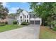 Inviting two-story home featuring a two-car garage and well-maintained lawn and landscaping at 4294 Silver Peak Pkwy, Suwanee, GA 30024