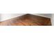 Close-up of gleaming hardwood floors with detailed wood grain, showing texture and finish at 4294 Silver Peak Pkwy, Suwanee, GA 30024