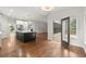 Open kitchen boasts a large center island with stainless steel appliances and modern pendant lighting at 4294 Silver Peak Pkwy, Suwanee, GA 30024