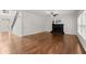 Spacious living room with gleaming hardwood floors and a cozy fireplace at 4294 Silver Peak Pkwy, Suwanee, GA 30024