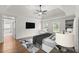 Spacious main bedroom features tray ceiling, ceiling fan, hardwood floors, and ensuite bathroom at 4294 Silver Peak Pkwy, Suwanee, GA 30024
