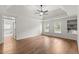 Spacious primary bedroom features a tray ceiling, windows, and an en suite bathroom entrance at 4294 Silver Peak Pkwy, Suwanee, GA 30024