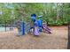Playground with slides and climbing area on woodchips, providing a fun and safe environment for to play and socialize at 4294 Silver Peak Pkwy, Suwanee, GA 30024