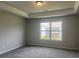 Bedroom with neutral walls, carpet, and a window view at 4514 Eastbrook Pl, Snellville, GA 30039
