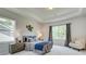 Comfortable bedroom featuring soft carpet, soothing wall color, and two large windows at 4514 Eastbrook Pl, Snellville, GA 30039